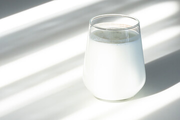 Close-up of a glass filled with fresh ayran. Refreshing yogurt-based drink.