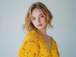 © Lifestyle - A young woman with blonde hair in a yellow floral dress  Perfect for fashion beauty or lifestyle websites and publications