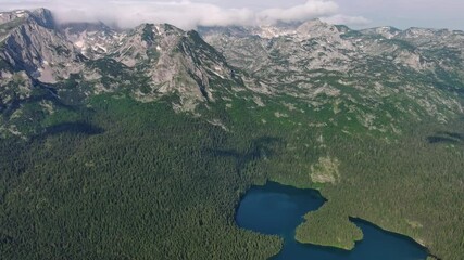 Wall Mural - aerial view of famous black lake in mountain durmitor park at summer, montenegro, 4k