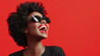 © Visual Craft - Woman wearing sunglasses is smiling and laughing