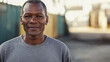 © Atmospheric stock - Portrait of a mature african male smiling outdoors in casual attire