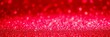 © Somnuek - Shimmering red glitter sparkles on abstract background, holiday, vibrant