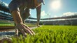 © Wan - Groundskeeper Preparing Baseball Field Under Bright Sunlight