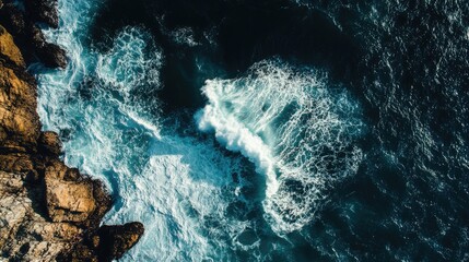 Leinwandbilder - Aerial Perspective of Waves Crashing on Rocky Coastline with Space for Text and Dramatic Oceanic Landscape
