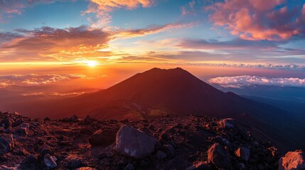 Aufkleber - Stunning panoramic sunrise view from a volcanic summit over majestic mountain landscapes and dramatic clouds