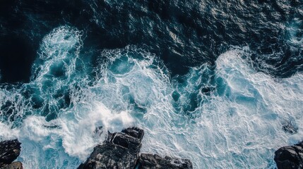Leinwandbilder - Aerial View of Turbulent Ocean Waves Crashing Against Rugged Rocky Shoreline with Blank Space for Text Overlay