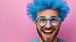 © Nataliia_Trushchenko - Man with blue hair and glasses is smiling and looking at the camera. The image has a fun and lighthearted mood, as the man's blue hair and glasses give him a quirky and playful appearance