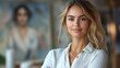 © Veronika - Confident woman smiling warmly while standing in an art-filled space with a soft, inviting atmosphere during daytime