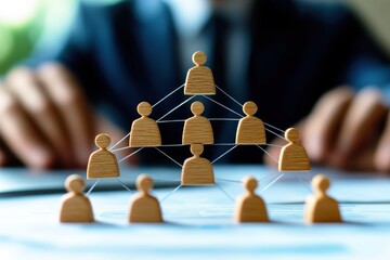 Wall Mural - wooden figures representing team structure and hierarchical organization in business management conc