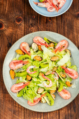 Wall Mural - Seafood salad with shrimps and mussels on plate.