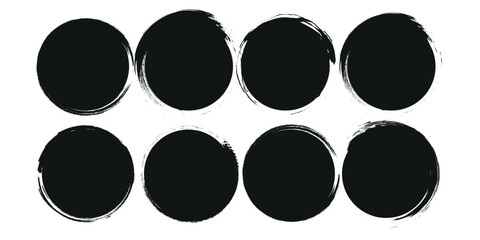 a collection of black grunge circular shapes on a white background, featuring paintbrush style stamp