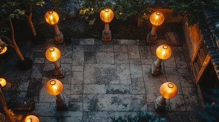 Poster - Illuminated Courtyard Lanterns Adorn Stone Patio