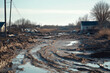 © tynza - Aftermath of a flood with a completely transformed landscape, showing dried mud and ruined infrastructure.