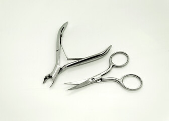 Nail nippers and scissors. Manicure tools on white background. Tools for nail and cuticle care