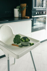 Wall Mural - Broccoli in a plate, first complementary food using the blw method