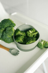 Wall Mural - Broccoli in a plate, first complementary food using the blw method