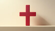 © SashaMagic - Red cross symbol on a beige background.