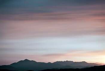 Wall Mural - tranquil soft captures silhouettes. hues landscape serene layered sunset mountain