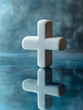 © SashaMagic - White cross with reflection on a blue surface.