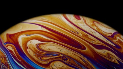 Wall Mural - Closeup video of a soap bubble showing thin film interference concept and the resulting different colors of light with each moving and swirling shapes. Perfect for illustrating concepts of physics.