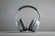 © khemthong - Wireless headphones floating on a gray background