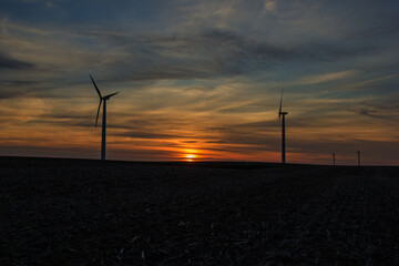 wind turbines at sunset