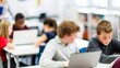 © Jo - Interactive Study Blur: Students working on a project in a classroom with blurred focus