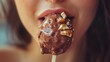 © Cucoo - A close-up of a person enjoying a chocolate-coated ice cream treat.