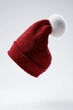 © Espresso - A festive red Santa hat with a fluffy white pom-pom, floating against a light background.