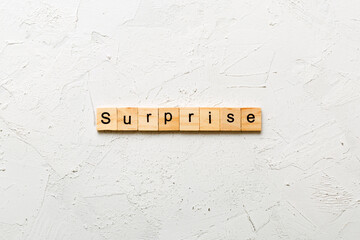 Wall Mural - surprise word written on wood block. surprise text on table, concept