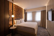 © rilueda - Modern hotel bedroom interior with master bed