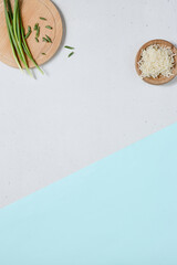 Wall Mural - Minimalist Kitchen Aesthetic with Green Onion and Cheese on Pastel Background