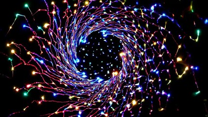 Poster - Colorful spiral of lights rotates in mesmerizing patterns during a nighttime display