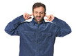 © Asier - Studio portrait of young Hispanic male covering ears with fingers, stressed and desperate by a loudly ambient.