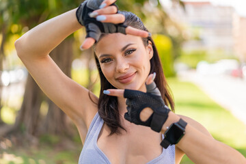 Wall Mural - Young pretty sport woman at outdoors With happy expression