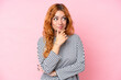 © luismolinero - Young caucasian woman isolated on pink background thinking an idea while looking up