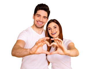 Close up photo amazing beautiful she her he him his guy lady hands arms fingers make heart figure form romance mood hugging sincere wear casual white t-shirts outfit isolated yellow background