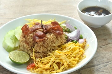 Wall Mural - fried rice mixed with shrimp paste eat couple egg and vegetable on plate