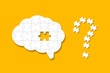 © ytemha34 - A missing piece of the brain puzzle on yellow background. A question mark design made of puzzle pieces.