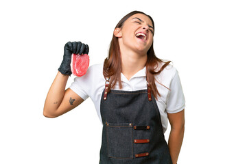 Wall Mural - Butcher woman wearing an apron and serving fresh cut meat isolated on green chroma background laughing