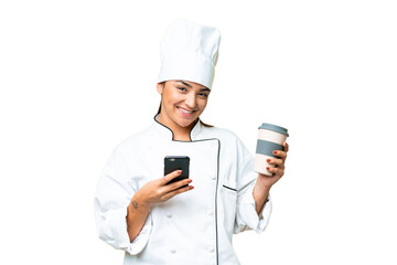 Wall Mural - Young woman Chef over isolated chroma key background holding coffee to take away and a mobile