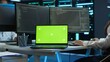 © DC Studio - Data center engineer responsible for installation of networking equipment solving tasks on isolated screen laptop. Woman doing maintenance on server room infrastructure using mockup notebook, camera A
