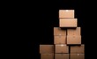 © PrusarooYakk - Stacked cardboard boxes in a dark space, showcasing a simple yet organized arrangement ideal for storage or shipping concepts.