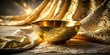 © Autun - Gold bowl, elegantly draped in black and beige fabric; a still life study in light and shadow.