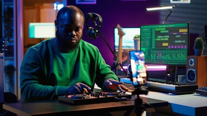 Poster - Music producer explaining faders and knobs on mixing console before teaching advanced post production stuff. Musical instructor gives advice about acoustical engineering, online vlog. Camera A.