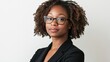 © Mandeep - headshot of a woman with glasses in a black jacket