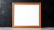 © Olivia - Empty copper frame on gray surface against dark background; mockup for artwork, design, or photography.