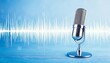 © sakda - Radio podcast or recording studio microphone with audio wave design.