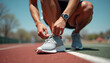 © Ludmila - Athletic man tying shoelaces, determined and active, on a sports track in the daytime