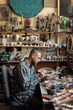 © Demetr White/Stocksy - sculptor paints a figure